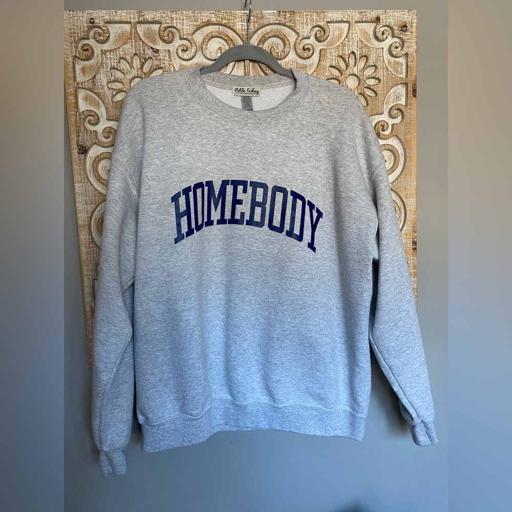 Heather grey crewneck with Homebody logo.